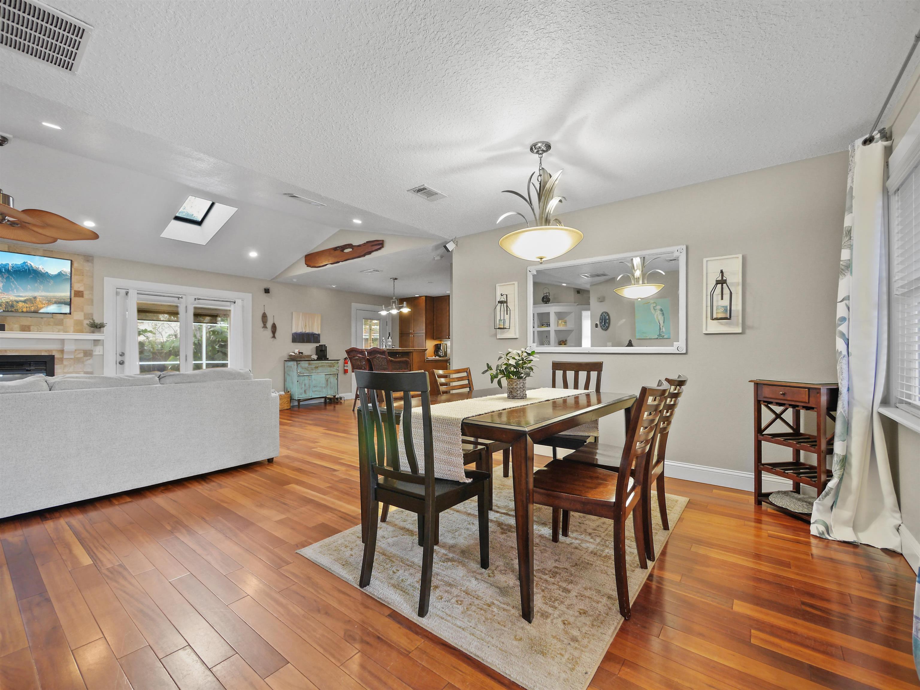 5301 1st Street St. Augustine, FL 32080 - Photo 9 of 36 a view of a dining room with furniture and wooden floor