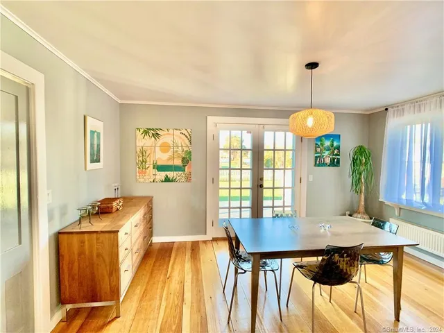 a open kitchen with dining table and chairs