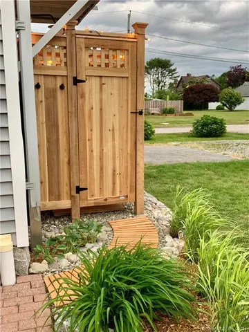a view of a porch with furniture and garden
