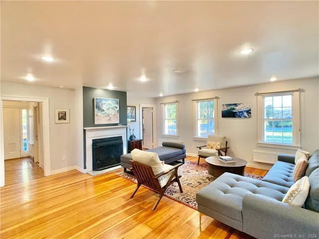 a living room with furniture or couch and a fireplace