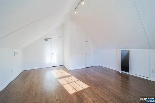 an empty room with wooden floor