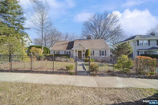 a front view of house with yard outdoor seating and barbeque oven