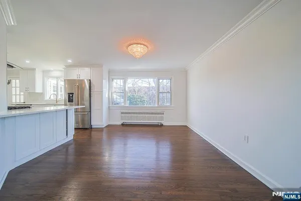 a view of a kitchen with a sink and a window