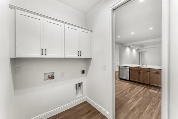 a view of cabinets and wooden floor