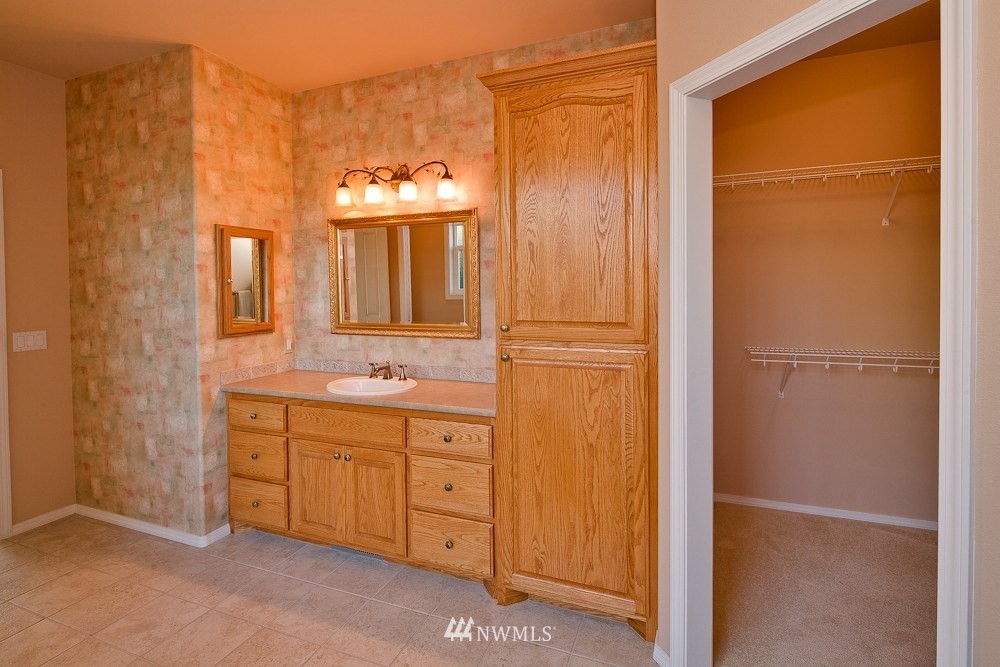 6829 Raspberry Dr. Everson, WA 98247 - Photo 12 of 17 a bathroom with a double vanity sink and a mirror