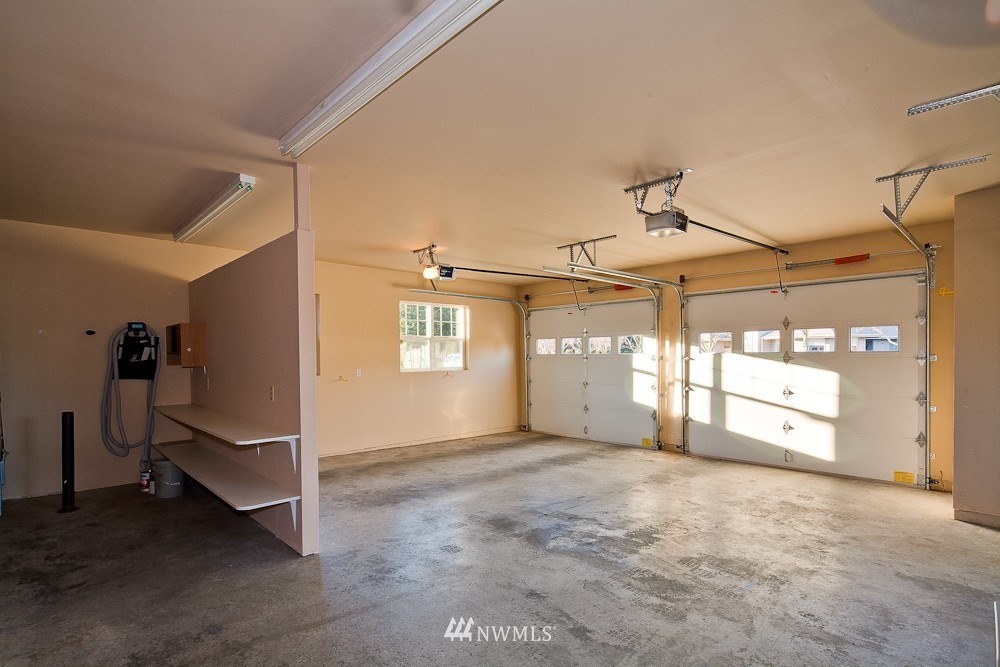 6829 Raspberry Dr. Everson, WA 98247 - Photo 15 of 17 a view of a livingroom with a staircase and a ceiling fan