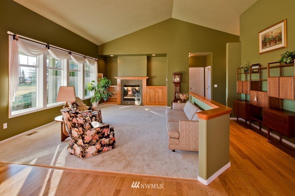 6829 Raspberry Dr. Everson, WA 98247 - Photo 5 of 17 a living room filled with furniture gym equipment and a large window