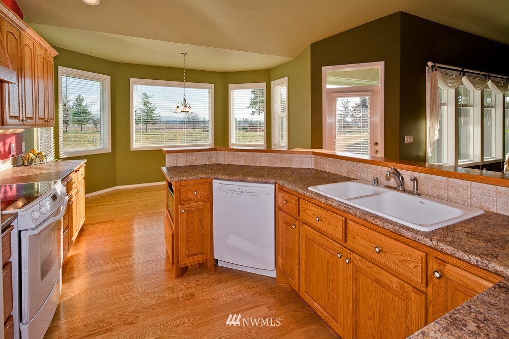 6829 Raspberry Dr. Everson, WA 98247 - Photo 9 of 17 a spacious bathroom with a granite countertop sink and a large mirror