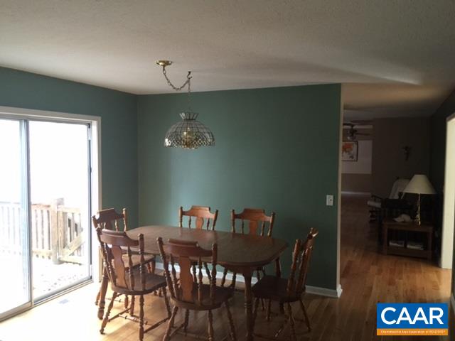 4248 Roundabout Road Louisa, VA 23093 - Photo 4 of 9 a view of a dining room with furniture window and wooden floor