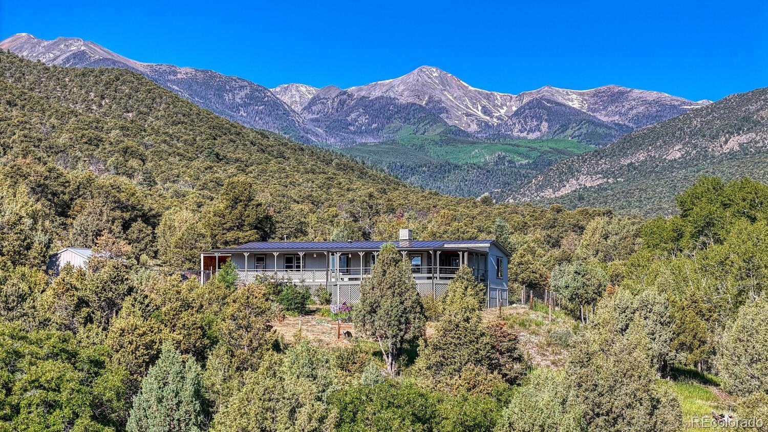 236 Boreen Way Howard, CO 81233 - Photo 1 of 30 a view of a house with a mountain in the background