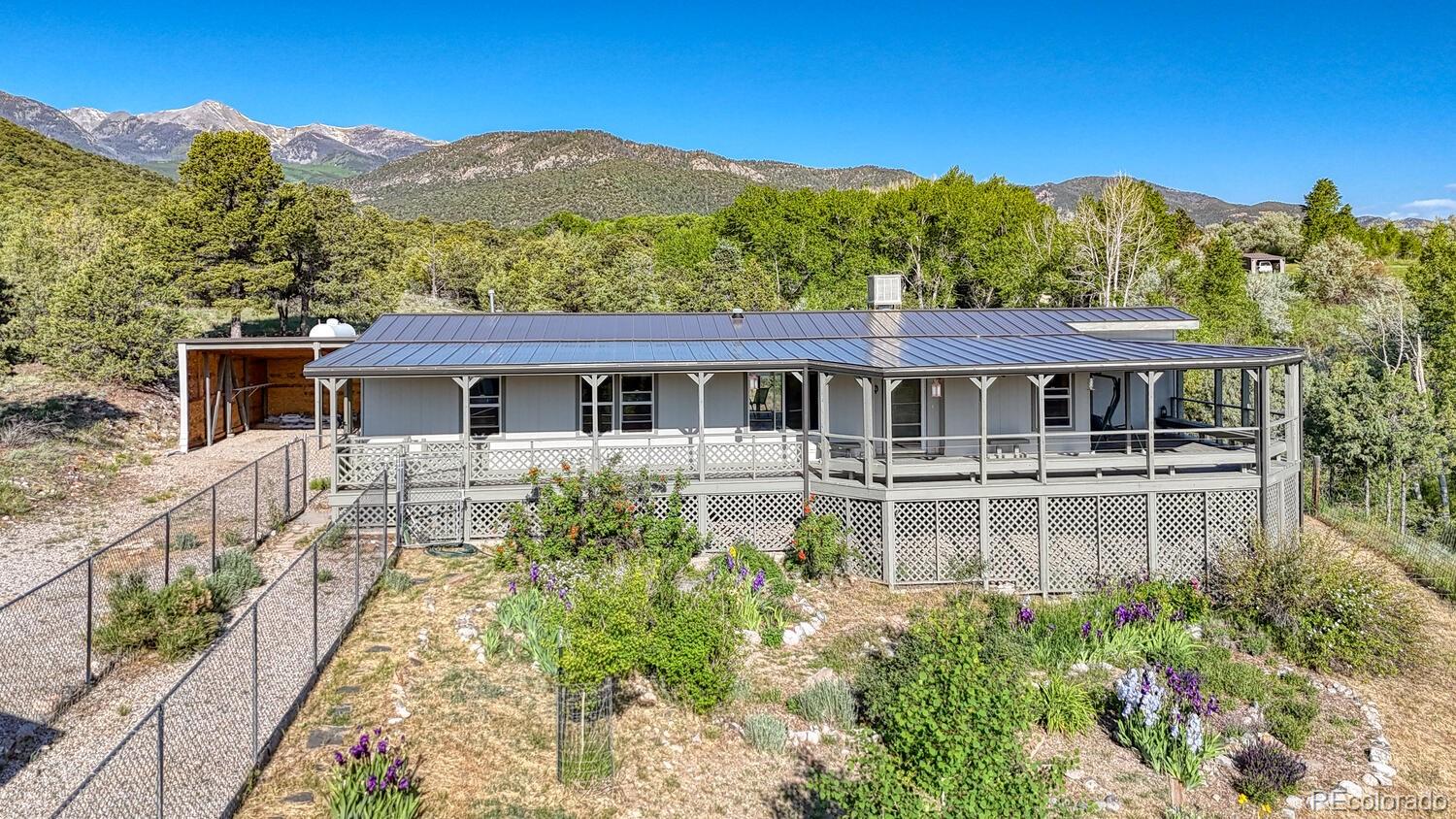 236 Boreen Way Howard, CO 81233 - Photo 2 of 30 a front view of a house with a yard