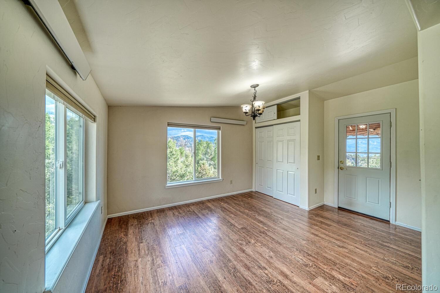 236 Boreen Way Howard, CO 81233 - Photo 22 of 30 wooden floor in an empty room with a window