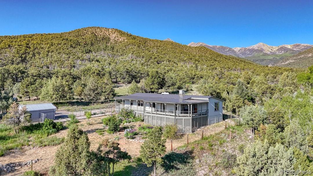 236 Boreen Way Howard, CO 81233 - Photo 4 of 30 a view of a large building with a mountain in the background