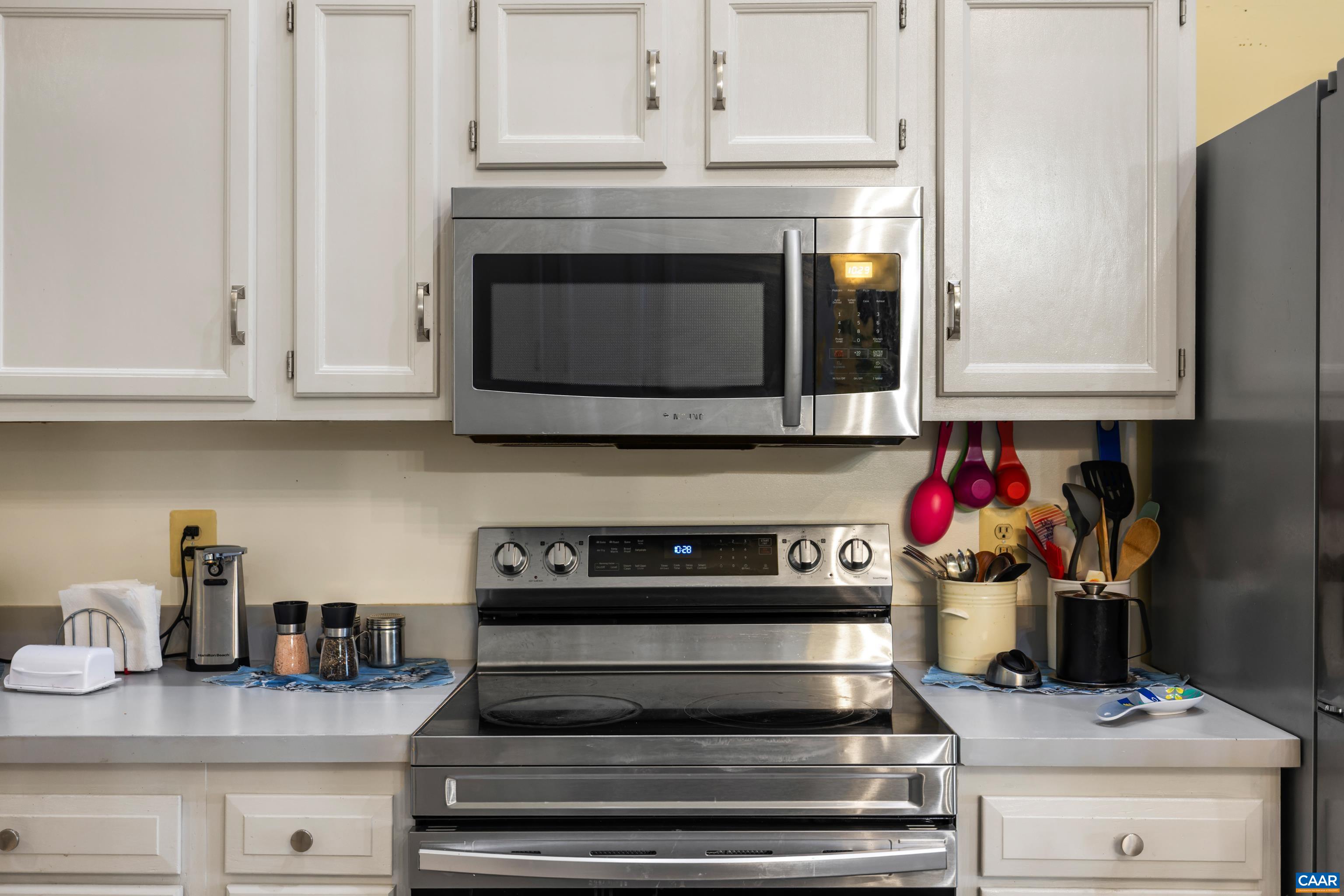 465 Hidden Ridge Road Charlottesville, VA 22902 - Photo 15 of 63 a kitchen with stainless steel appliances granite countertop white cabinets and a stove top oven