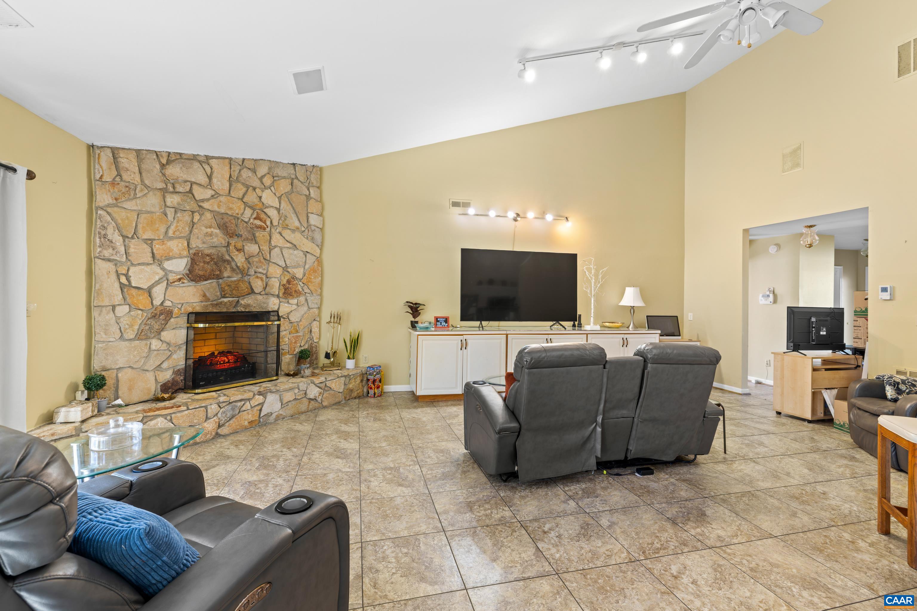 465 Hidden Ridge Road Charlottesville, VA 22902 - Photo 20 of 63 a living room with furniture and a flat screen tv