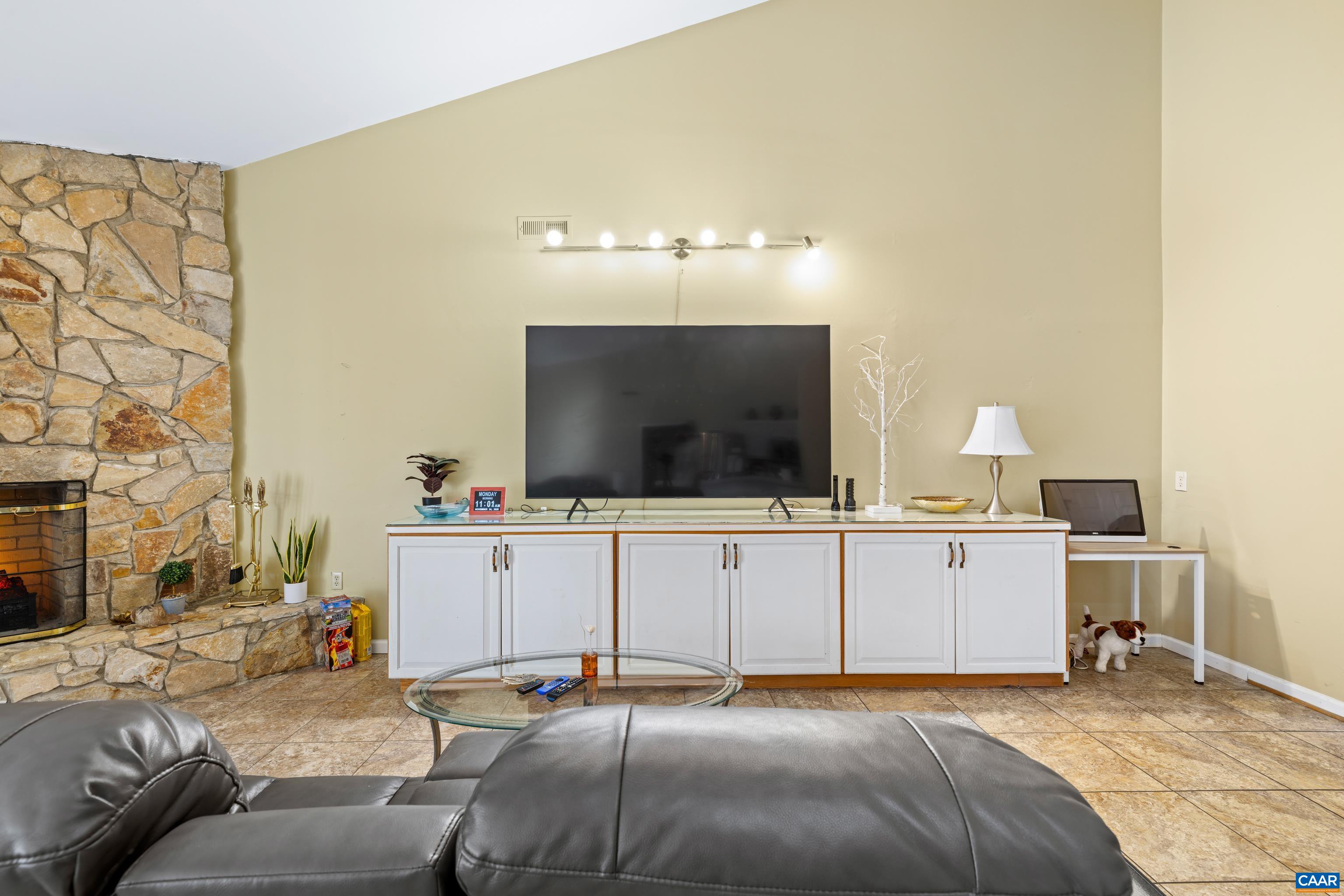 465 Hidden Ridge Road Charlottesville, VA 22902 - Photo 21 of 63 a bedroom with furniture and a flat screen tv