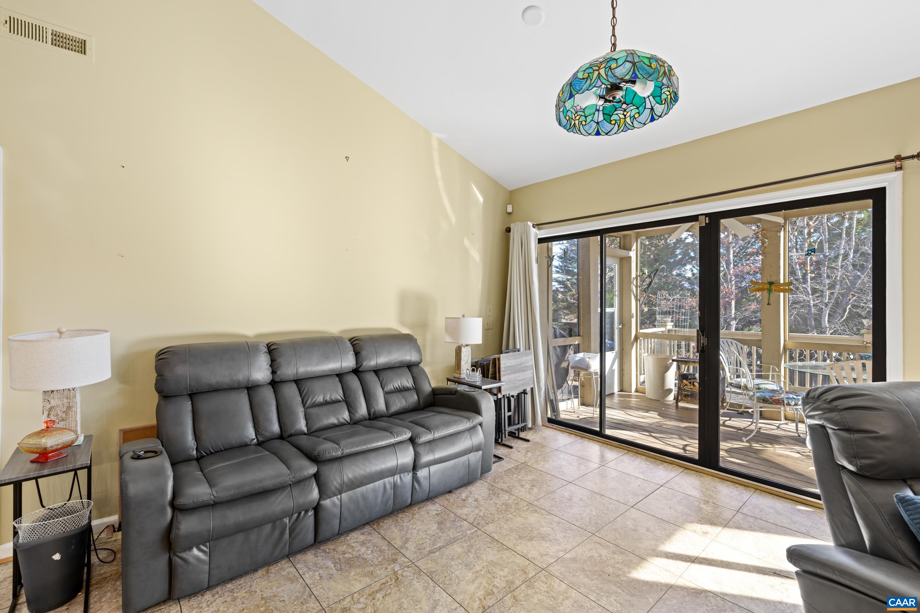 465 Hidden Ridge Road Charlottesville, VA 22902 - Photo 25 of 63 a living room with furniture and a floor to ceiling window