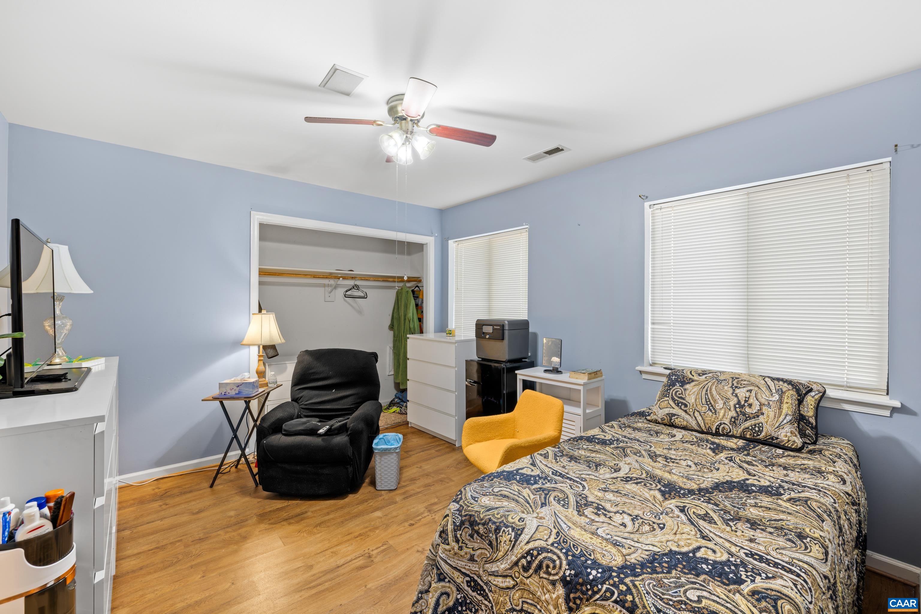 465 Hidden Ridge Road Charlottesville, VA 22902 - Photo 35 of 63 a bedroom with furniture and a flat screen tv