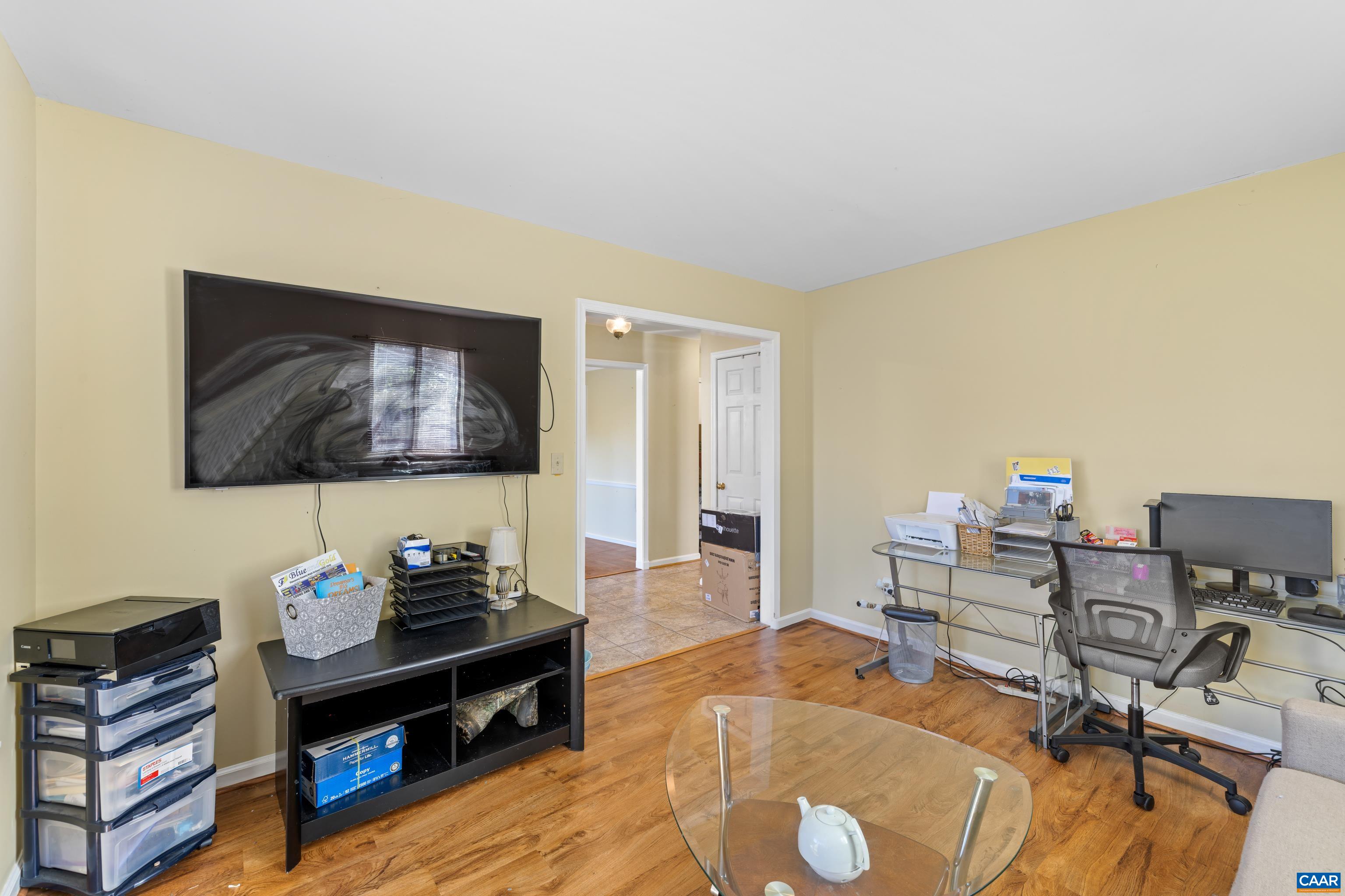 465 Hidden Ridge Road Charlottesville, VA 22902 - Photo 5 of 63 a living room with furniture and a flat screen tv