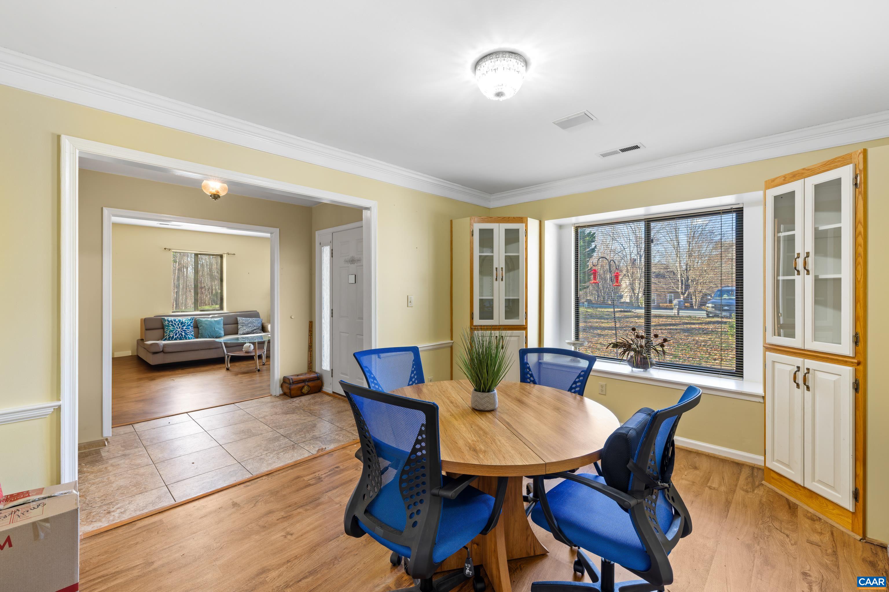 465 Hidden Ridge Road Charlottesville, VA 22902 - Photo 6 of 63 a view of a dining room with furniture window and wooden floor