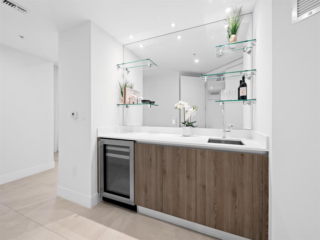 321 North Birch Road, Unit 502 Fort Lauderdale, FL 33304 - Photo 26 of 56 a bathroom with a sink double vanity and a mirror