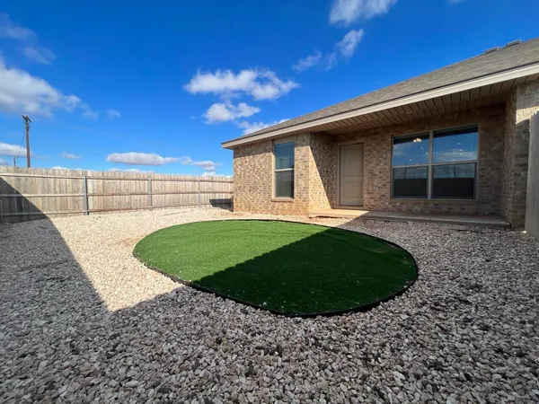 a view of a backyard with a garden