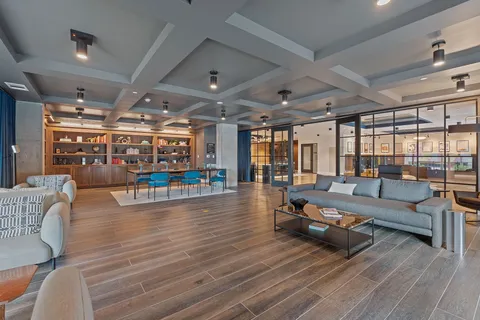 a living room with furniture and a table