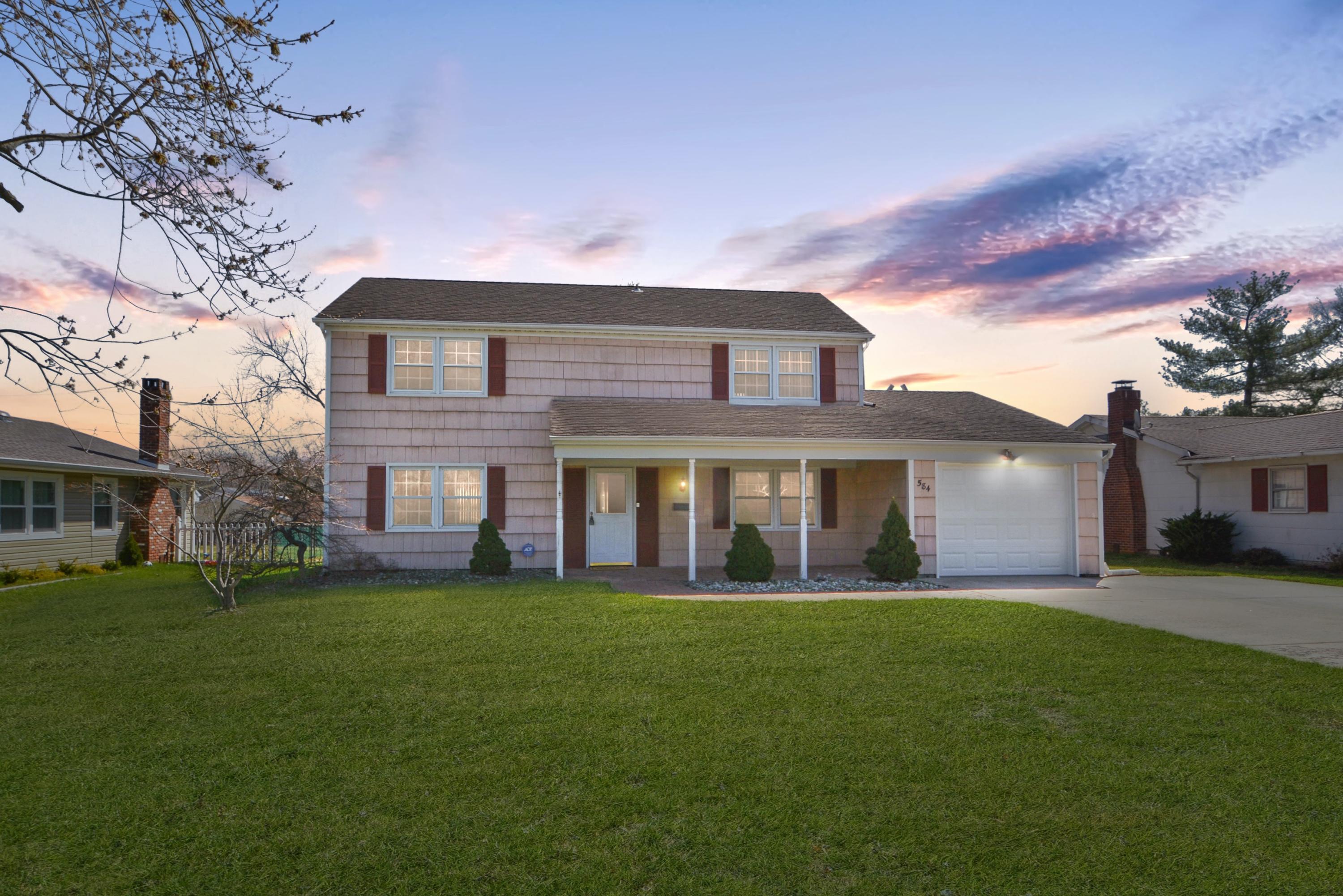 584 Lloyd Road Aberdeen, NJ 07747 - Photo 1 of 5 a front view of a house with a yard