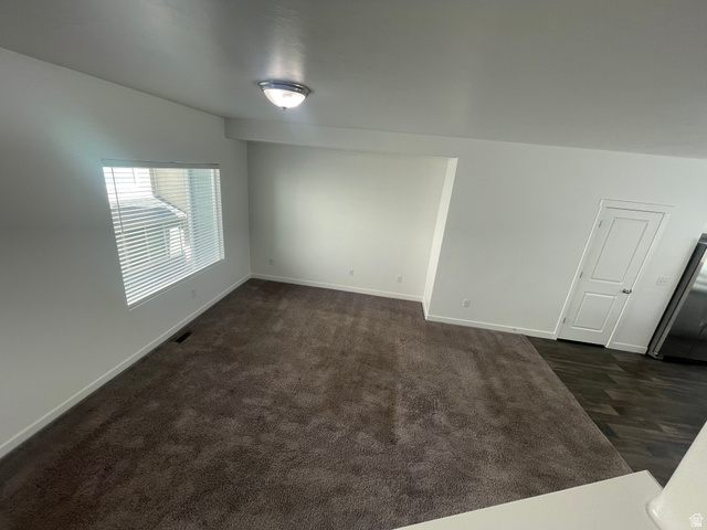 14760 Rising Star Way, Unit 71 Bluffdale, UT 84065 - Photo 18 of 41 Expansive interior with neutral wall finishes, plush carpet, recessed window with blinds, overhead flush mount lighting, and a paneled interior door