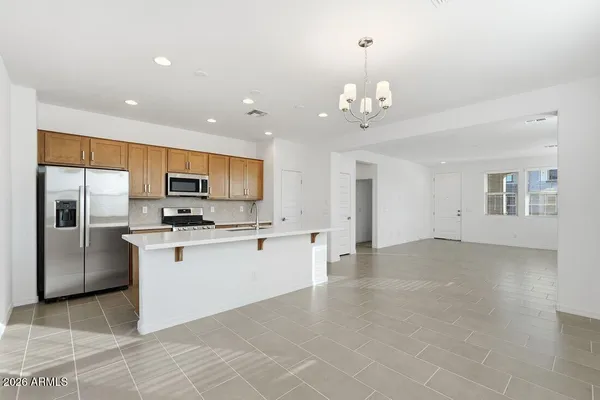 a view of a kitchen with electric appliances