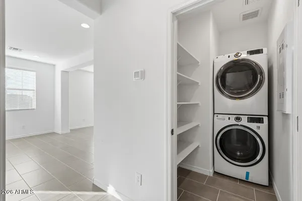a view of a hallway with washer and dryer