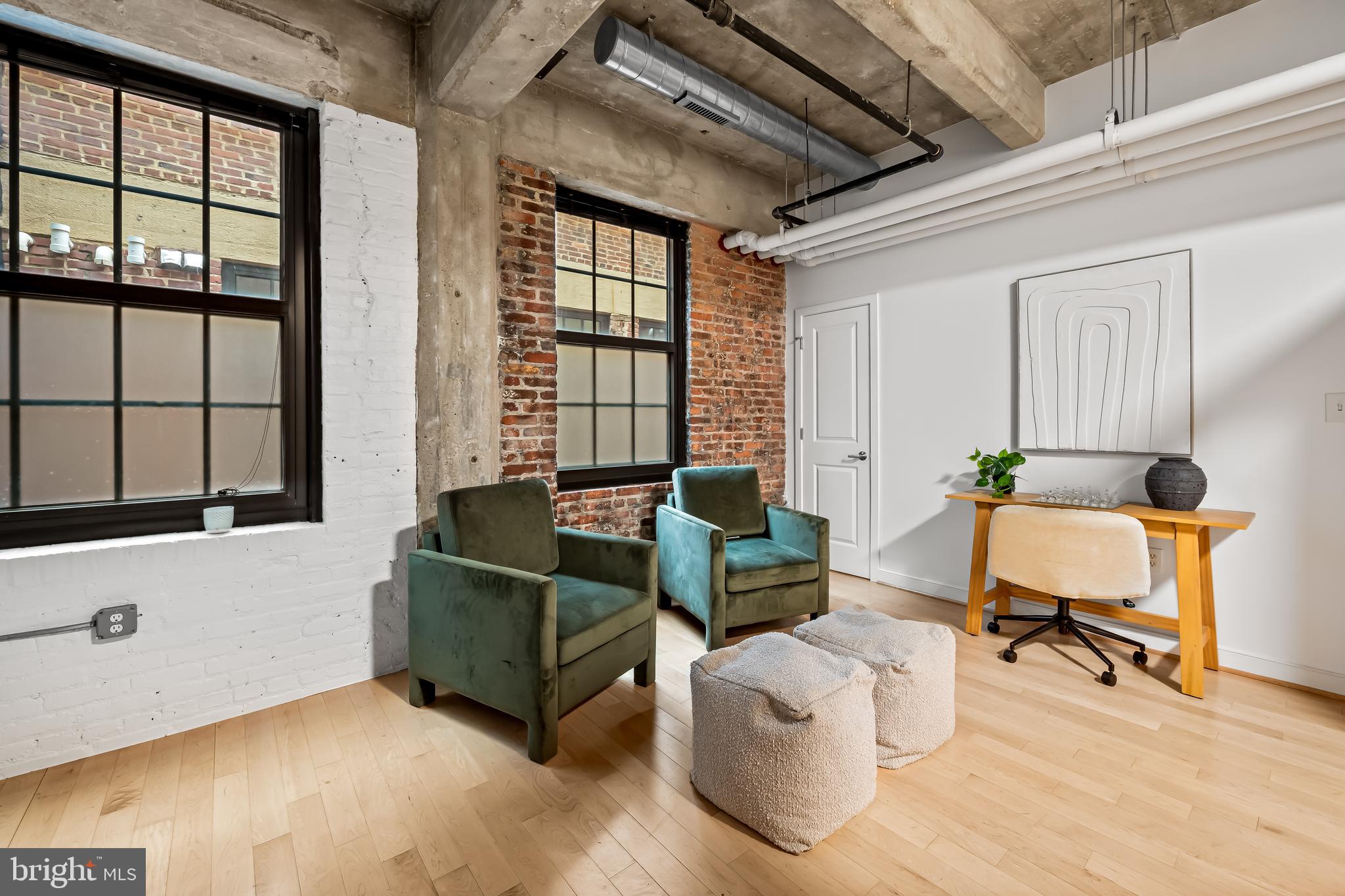 234 Holliday Street, Unit 502 Baltimore, MD 21202 - Photo 8 of 36 a living room with furniture and a window