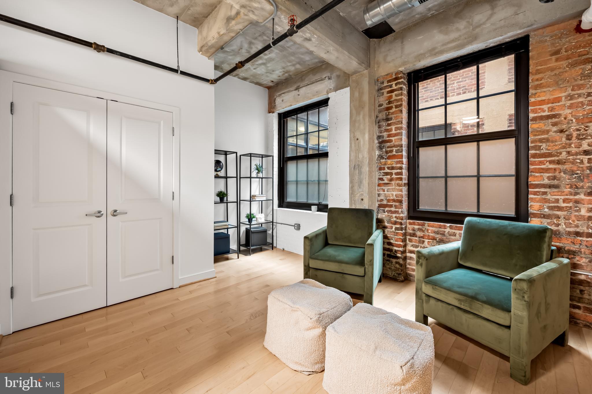 234 Holliday Street, Unit 502 Baltimore, MD 21202 - Photo 9 of 36 a living room with furniture and a window