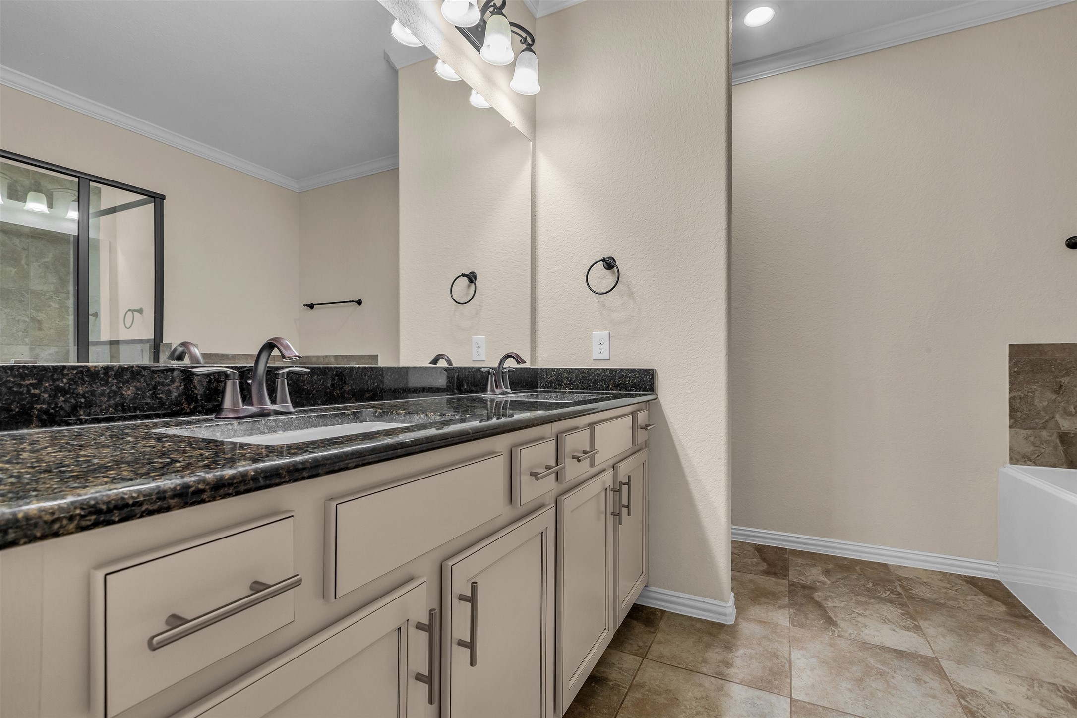 9023 South Comanche Circle Willis, TX 77378 - Photo 12 of 28 a bathroom with a sink and a mirror