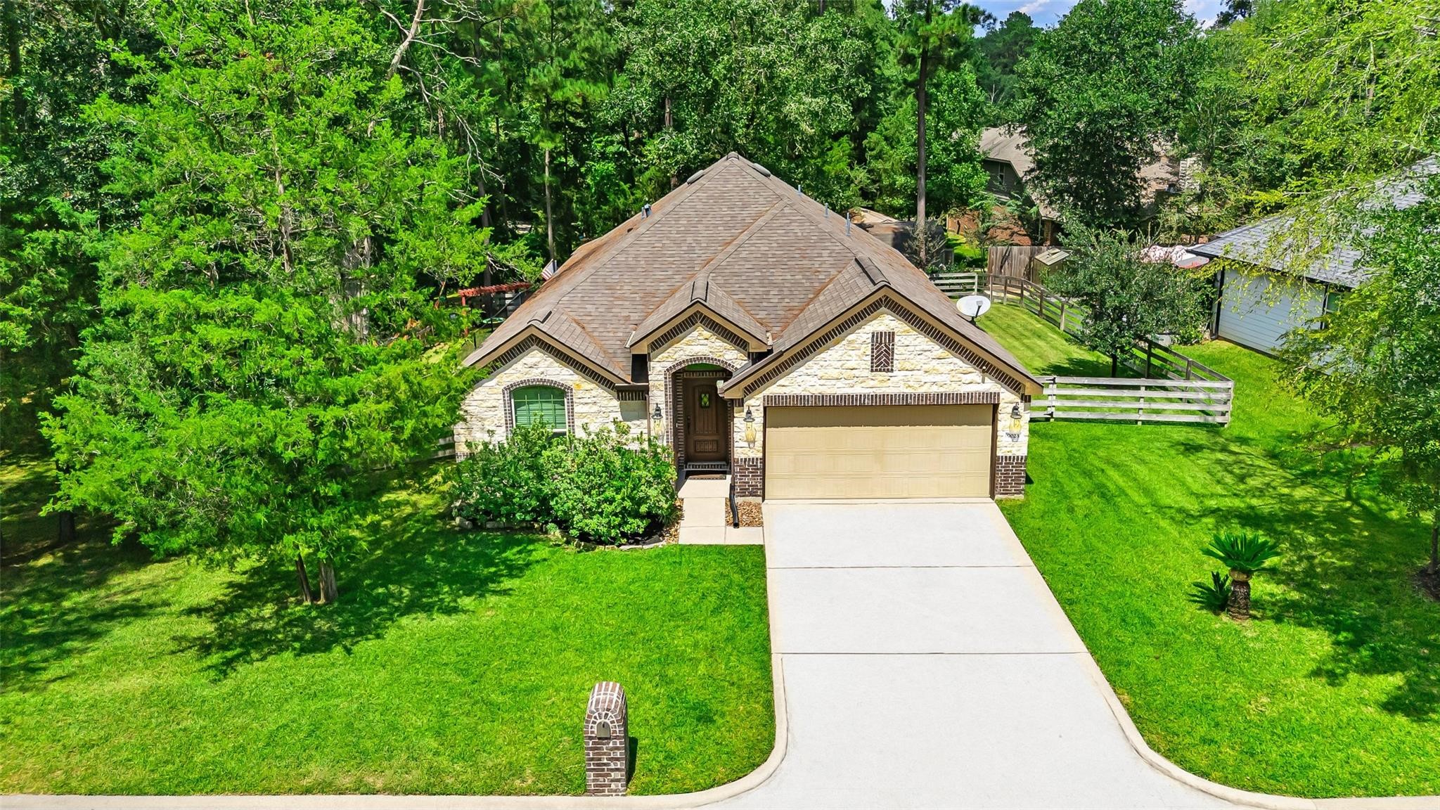 9023 South Comanche Circle Willis, TX 77378 - Photo 2 of 28 a view of house with backyard
