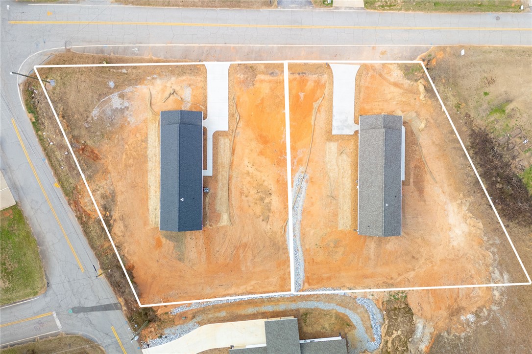115 Riley Street Westminster, SC 29693 - Photo 44 of 46 This aerial view showcases a lot with two newly constructed homes and their driveways.