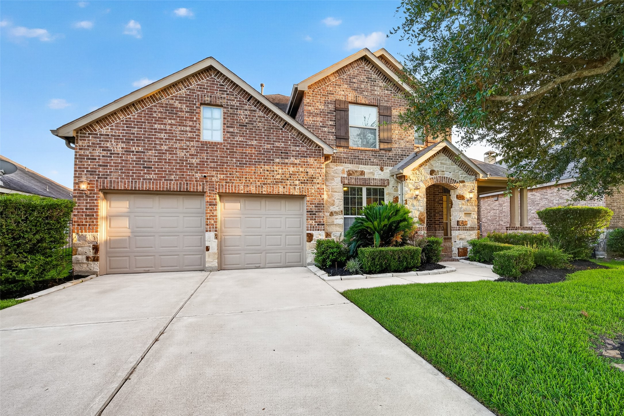 7930 Summer Night Lane Rosenberg, TX 77469 - Photo 41 of 48 Beautiful traditional brick-and-stone exterior with manicured landscaping and exceptional curb appeal.