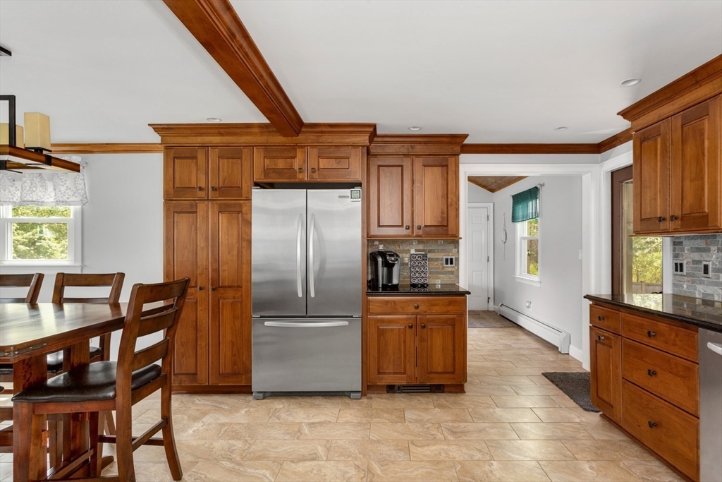 19 Colt Road Franklin, MA 02038 - Photo 15 of 36 a kitchen with stainless steel appliances a refrigerator and wooden cabinets