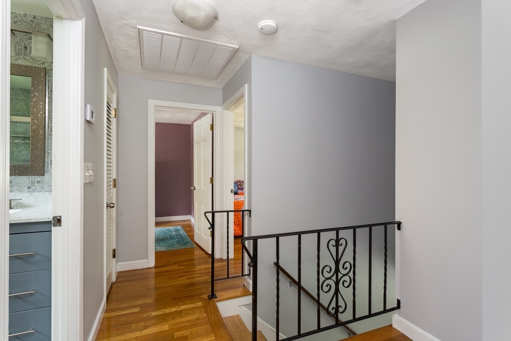 19 Colt Road Franklin, MA 02038 - Photo 20 of 36 a view of a hallway with wooden floor and entryway