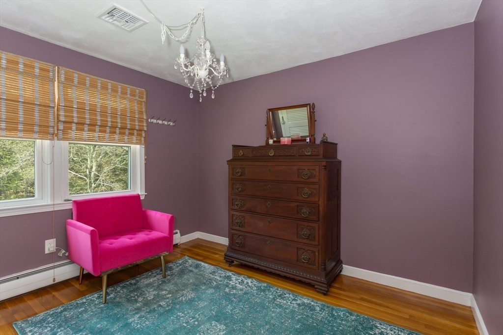 19 Colt Road Franklin, MA 02038 - Photo 25 of 36 a living room with furniture and a chandelier