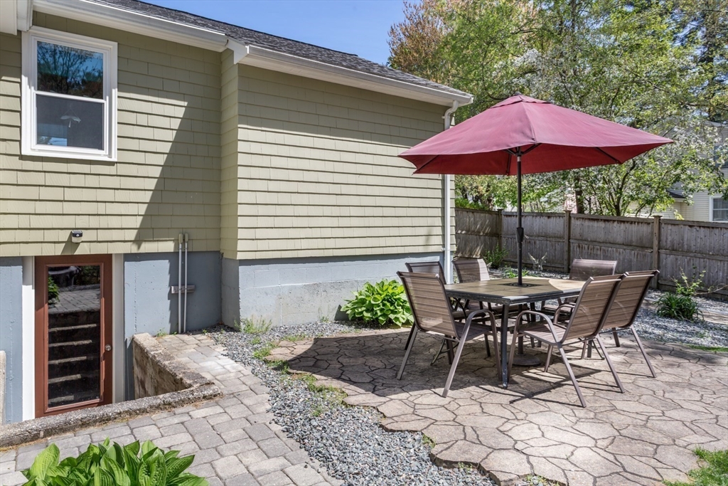 19 Colt Road Franklin, MA 02038 - Photo 30 of 36 a view of a table and chairs under an umbrella