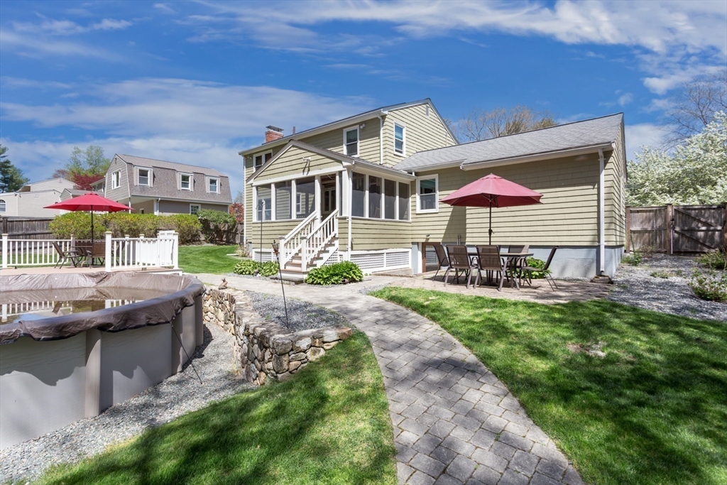 19 Colt Road Franklin, MA 02038 - Photo 33 of 36 a front view of a house with a garden and porch