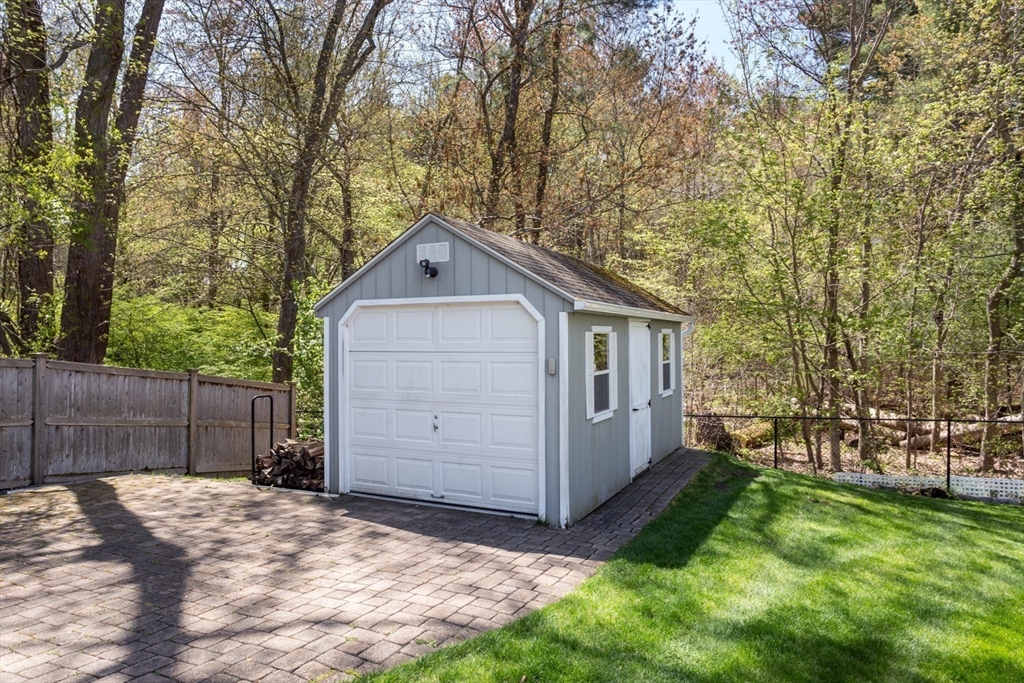 19 Colt Road Franklin, MA 02038 - Photo 34 of 36 a front view of a house with a yard and garage
