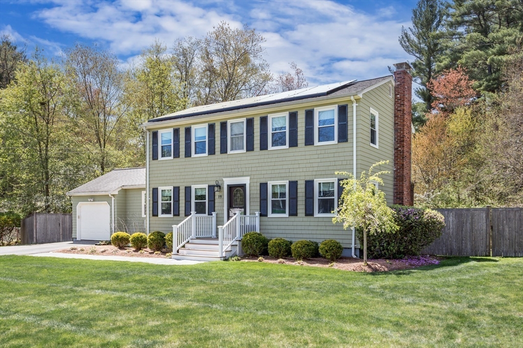 19 Colt Road Franklin, MA 02038 - Photo 35 of 36 a front view of a house with a garden and plants