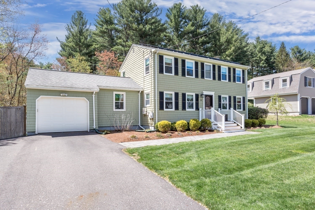 19 Colt Road Franklin, MA 02038 - Photo 36 of 36 a front view of a house with yard and green space