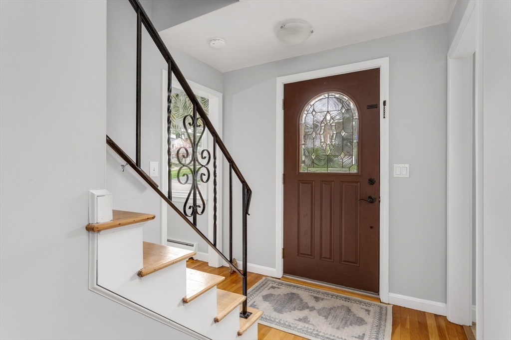 19 Colt Road Franklin, MA 02038 - Photo 4 of 36 a view of entryway and hall with wooden floor
