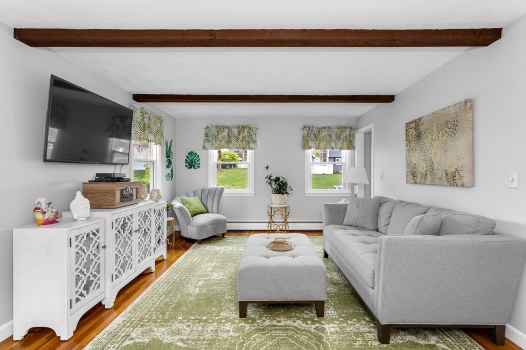 19 Colt Road Franklin, MA 02038 - Photo 7 of 36 a living room with furniture and a flat screen tv