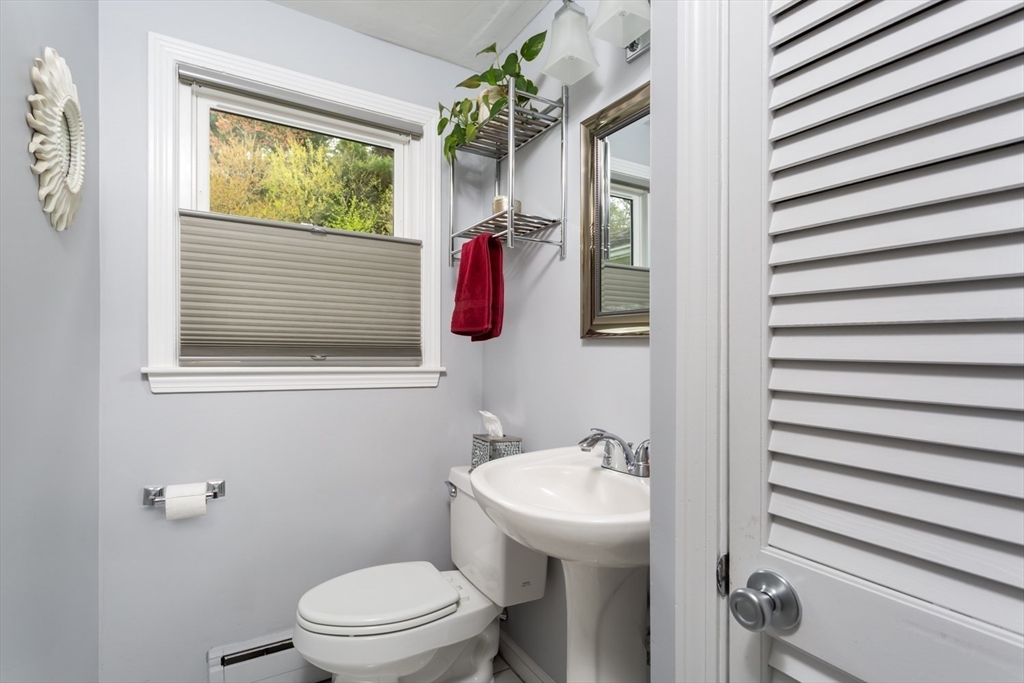 19 Colt Road Franklin, MA 02038 - Photo 9 of 36 a bathroom with a shower curtain and a sink