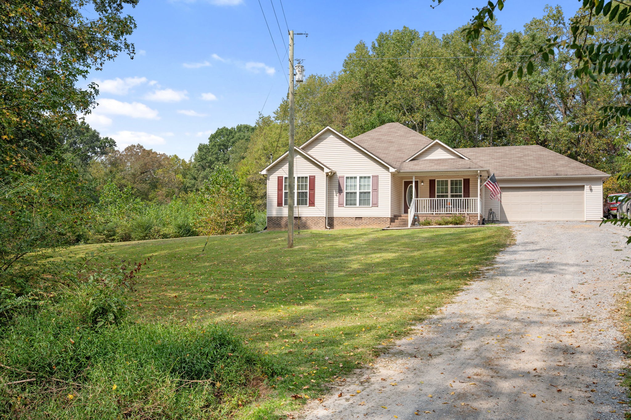 121 Wells Lee Road Elora, TN 37328 - Photo 29 of 48 a front view of a house with a garden