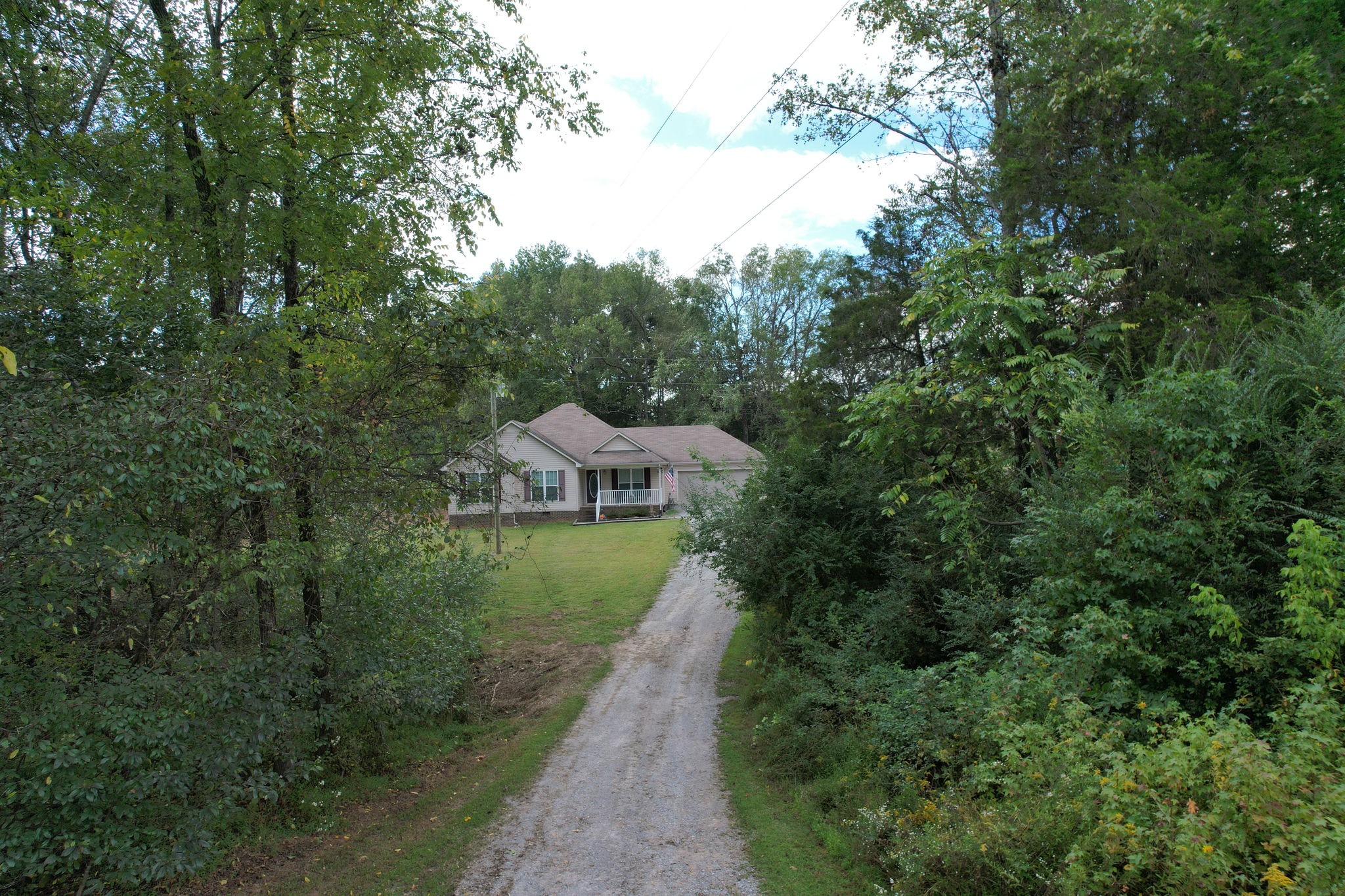 121 Wells Lee Road Elora, TN 37328 - Photo 37 of 48 a view of a house with a yard and large trees
